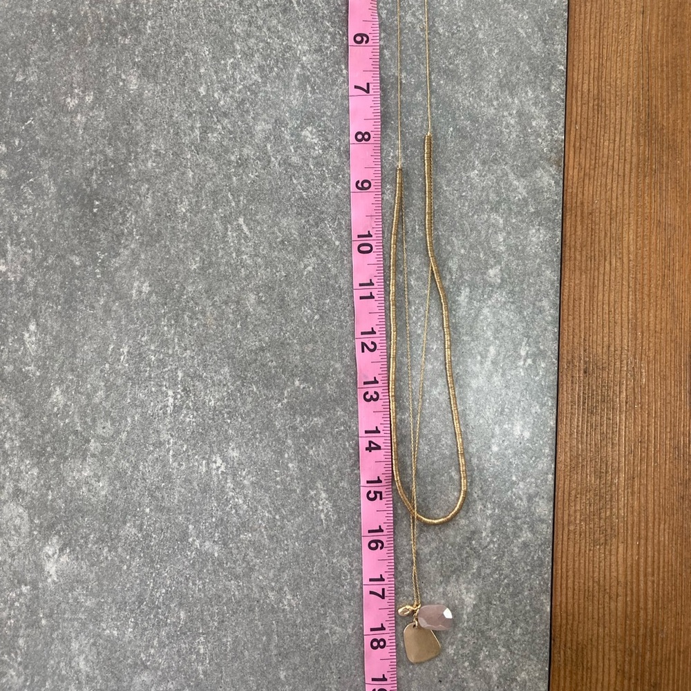Layered gold necklace with pink quartz